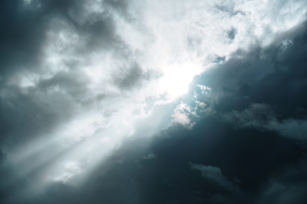 Sunbeam shining through darkness
