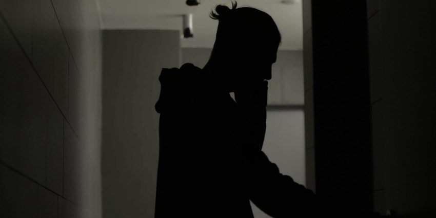 teacher standing outside a classroom