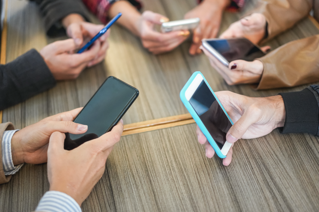 young-friends-having-fun-together-using-mobile-pho-2025-02-22-01-43-59-utc